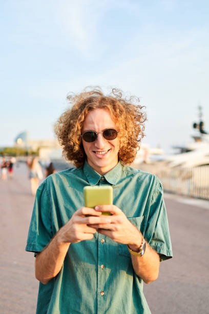istock Young hipster guy talking on mobile phone 1343906379
