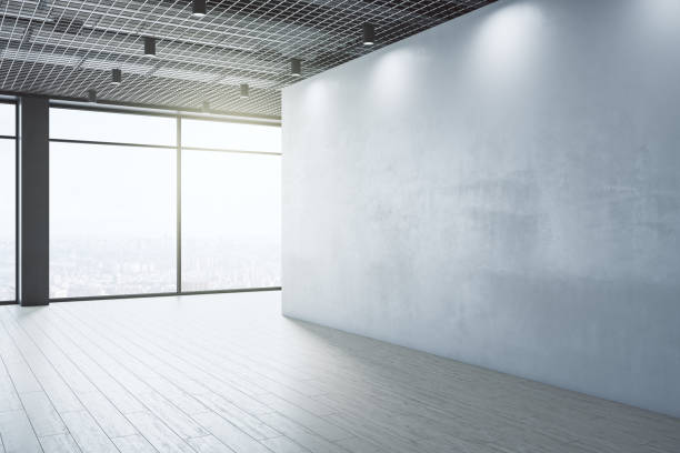 istock Clean empty interior with blank mock up place on wall, windows, city view and daylight. Design and gallery concept. 3D Rendering. 1343910690