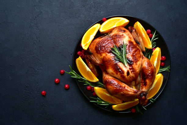 istock Roasted christmas chicken with oranges ,rosemary and cranberries 1343910713
