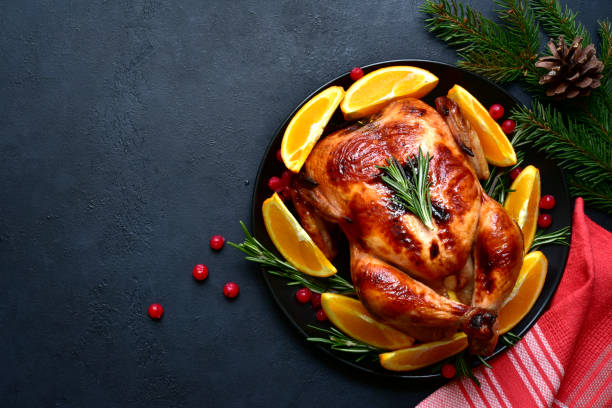 istock Roasted christmas chicken with oranges ,rosemary and cranberries 1343910719