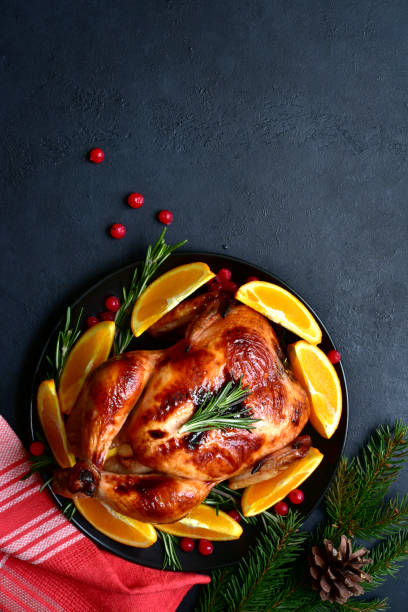 istock Roasted christmas chicken with oranges ,rosemary and cranberries 1343910721