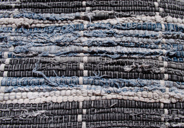 istock Gray, white and blue woven carpet background. 1343910749