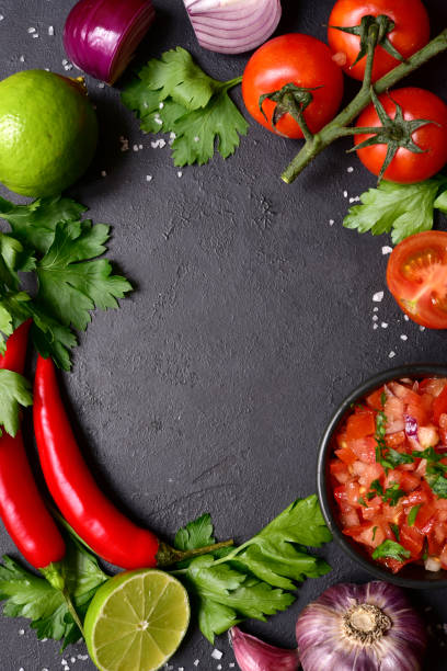 istock Tomato salsa (salsa roja) - traditional mexican sauce  with ingredients for making 1343910793