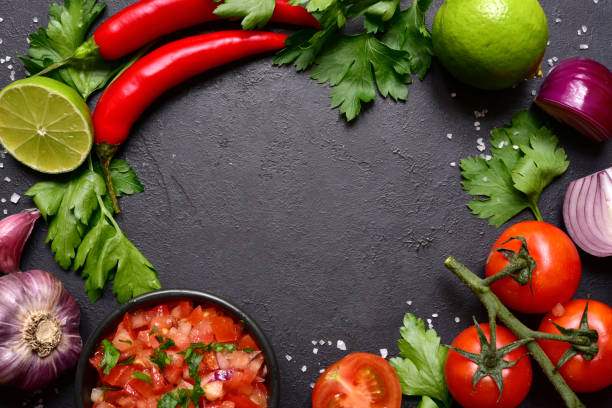 istock Tomato salsa (salsa roja) - traditional mexican sauce  with ingredients for making 1343910794