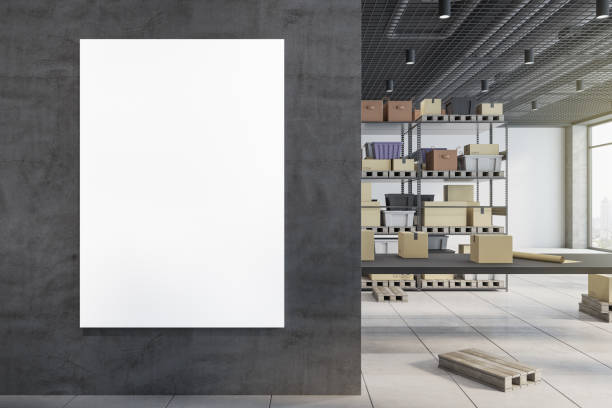 istock Modern warehouse interior with empty mock up frame on wall, racks, boxes, city view and daylight. Logistics and shipping concept. 3D Rendering. 1343910842
