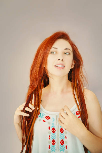 istock Red-haired girl with long dreadlocks. 1343920224