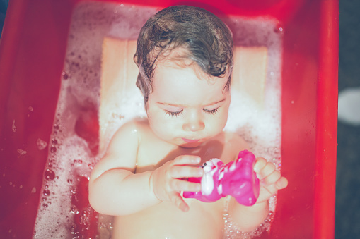 Cute baby taking a bath