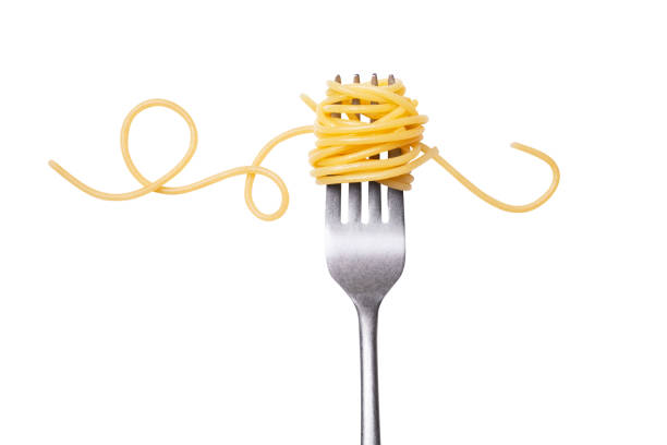 spaghetti rolled on fork stock photo