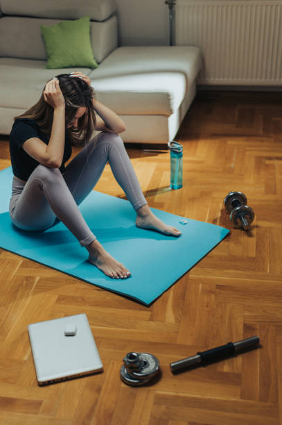 istock Woman being tired after her training at home 1343926165