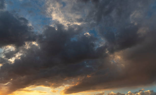 istock Beautiful bright sunset sky with clouds. Sky background. 1343928496