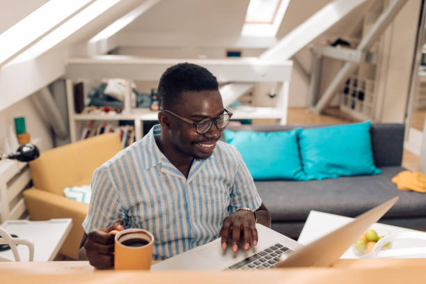 istock Happy African American student preparing the exam at home 1343933267