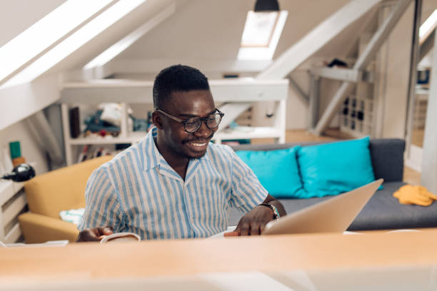 istock Happy African American student preparing the exam at home 1343933268
