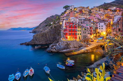 Riomaggiore,  Colorful cityscape on the mountains over Mediterranean sea in Cinque Terre Italy Europe