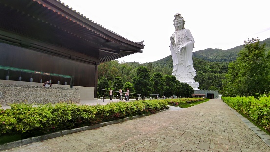 Hong Kong, june 2021. Tsz Shan Monastery is a large Buddhist temple located in Tung Tsz, Tai Po District, Hong Kong. Within the monastery, there is a 76-meter tall statue of Rúyìlún Guānyīn