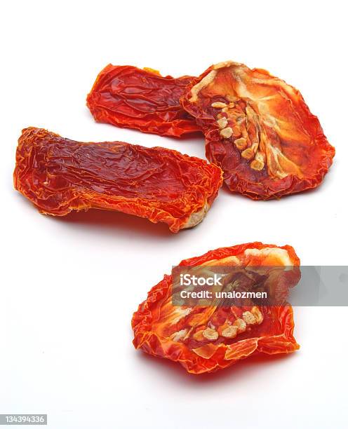 Picture Of Dried Tomatoes On A White Background Stock Photo - Download Image Now - Sun Dried Tomato, White Background, Cut Out