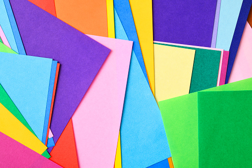 Overhead shot of abstract multi colored paper background.