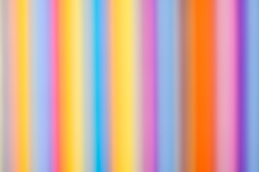 Overhead shot of defocused abstract multi colored paper background.