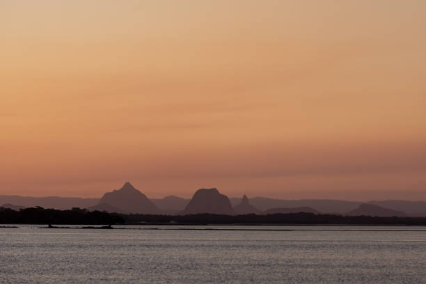 Dusk At Glass House Mountains Australia Viewed Across The Pumicestone Passage From Bribie Island