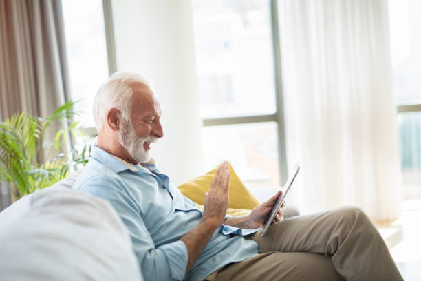 istock Senior man talking on a video call with loved ones. 1343960707