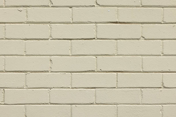 istock Part of a light green painted brick wall 1343962716