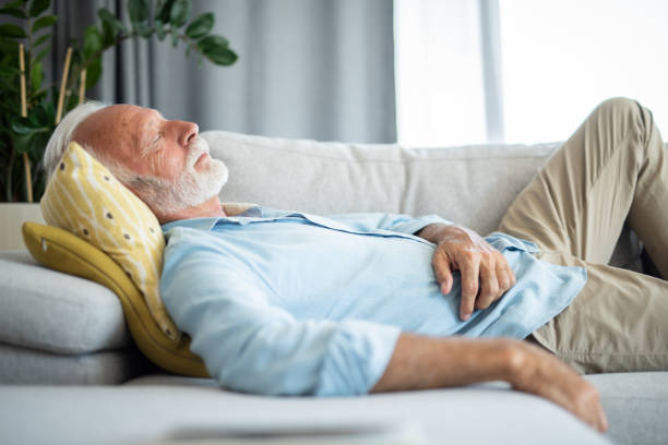 istock Senior man having a good nap at home. 1343962794