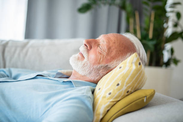 istock Senior man having a good nap at home. 1343962810