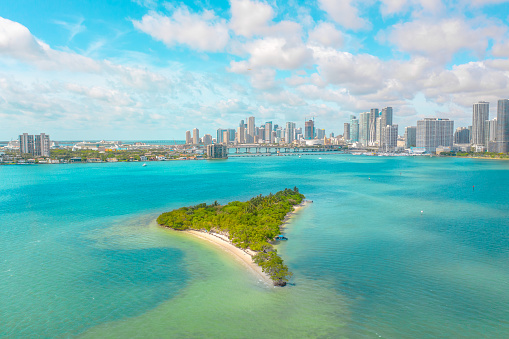 Fun island near Miami with beautiful blue water surrounding it including views of the city's skyline and cruise port
