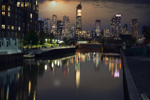 istock Skyscraper, towers in Downtown Brooklyn seen from Gowanus Canal during sunset 1343964664