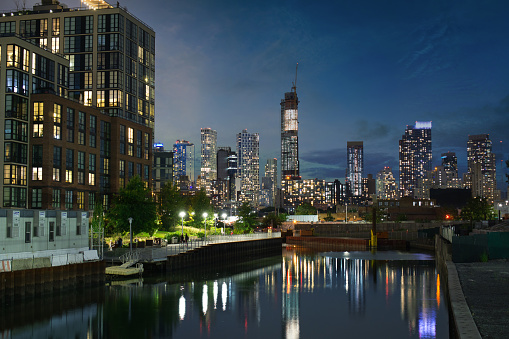 Skyscraper, towers in Downtown Brooklyn seen from Gowanus Canal during sunset