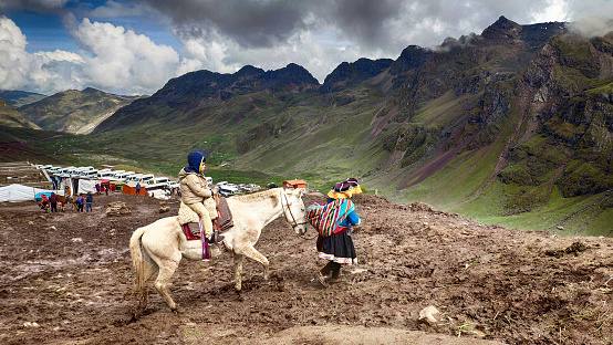 Rainbow Mountain, Peru - 25 Feb 2020: Horse riding to Rainbow Mountain in Cusco, Peru