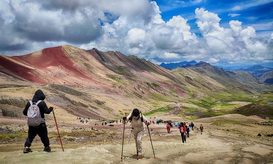 Rainbow Mountain, Peru - 25 Feb 2020: Hiking at amazing colourful Vinicunca or Rainbow Mountain (Montana of Seven Colors) in Peru