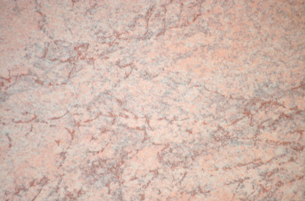 istock Pale pink agate, a polished natural stone surface with bright red veins. 1343970929