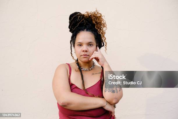 Young Africandescent Woman With Dreadlocks Looking At Camera Stock Photo - Download Image Now