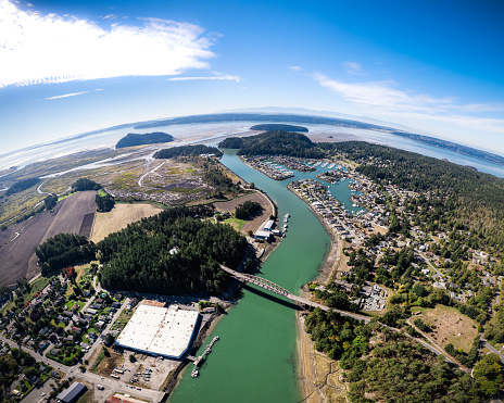 High drone perspective of small fishing town in Pacific Northwest