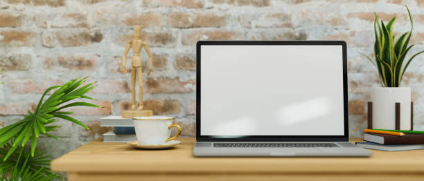 istock Modern vintage workspace with laptop screen mockup set against brick walls 1343981852
