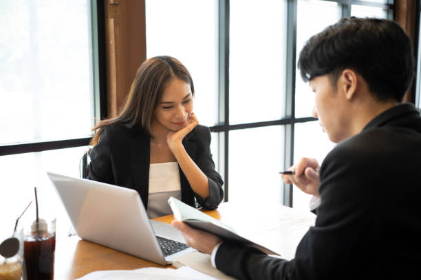 istock Two business colleagues working on new project together in office. 1343985974