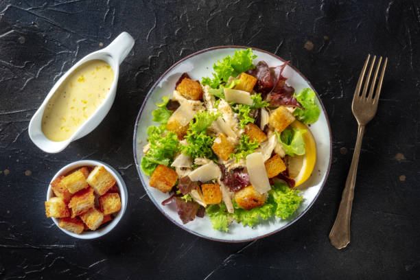 istock Chicken Caesar salad, overhead flat lay shot with the classic sauce 1343986261