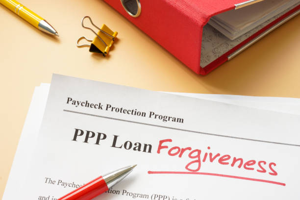istock PPP loan forgiveness handwritten word on the application. 1343987881