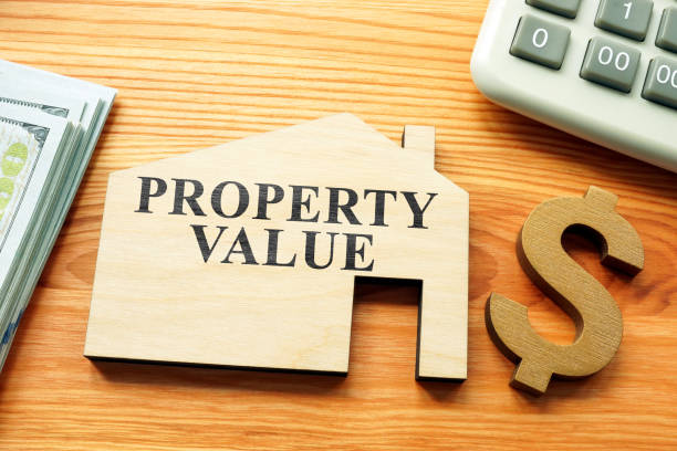istock Property value phrase on the model of house. 1343987914