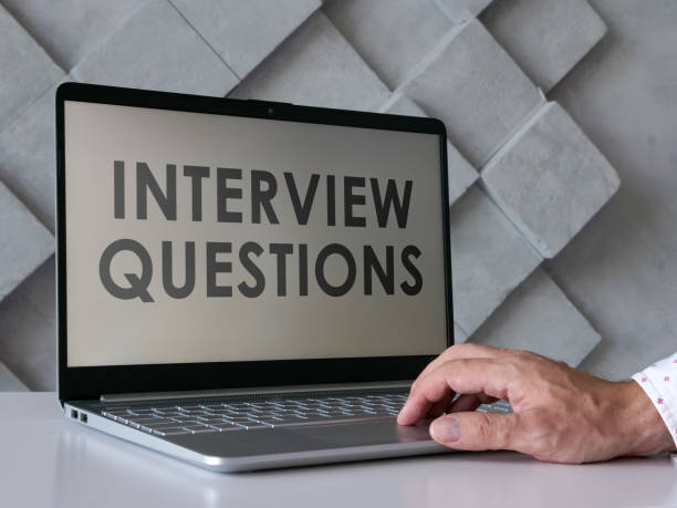 istock Man reads interview questions in the laptop. 1343987919