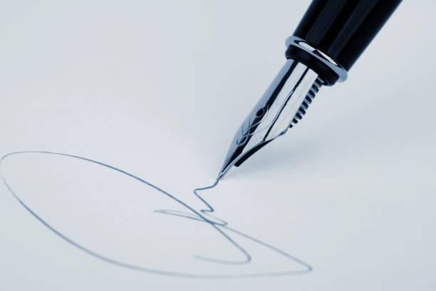 close up of fountain pen and signature. - contract signing document legal system imagens e fotografias de stock