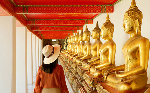 Female Visiting the Cloister with Large Group of Seated Buddha Images in Wat Pho or Temple of the Reclining Buddha, Bangkok Old City, Thailand, ( Self Portrait )