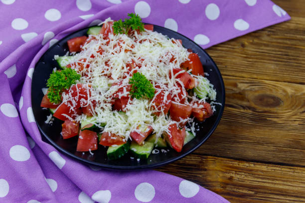 istock Traditional Bulgarian Shopska salad on wooden table 1343992707
