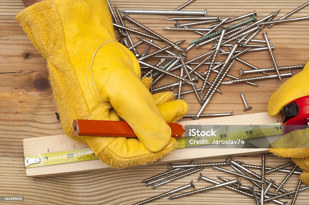 marking in meter The worker makes a marking in meter Construction Industry Stock Photo