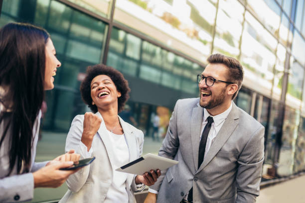 istock Business team celebrating a triumph, looking at digital tablet. 1343996160