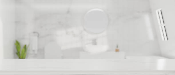 istock Mockup empty space for montage on white tabletop with blurred modern bright bathroom in background 1343997315