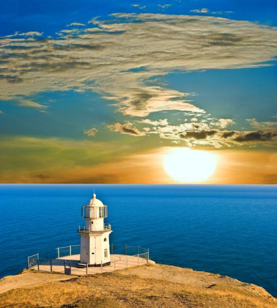 istock lighthouse above a sea at the sunset 1343997464