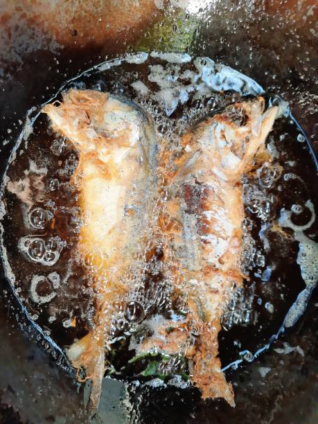 istock Frying Mackerel fish in boiling cooking oil. 1344000453