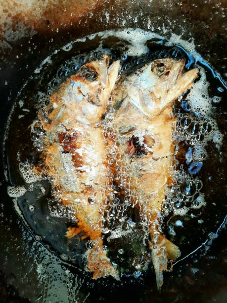 istock Frying Mackerel fish in boiling cooking oil. 1344000454