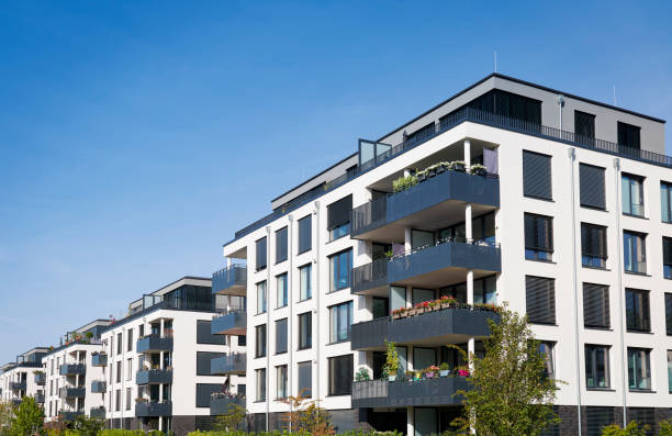 istock Modern white town houses and trees 1344001493